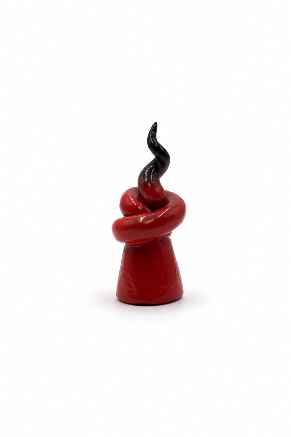 Glazed terracotta red horn with mask